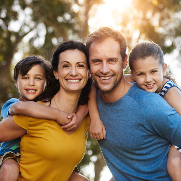 smiling family of four