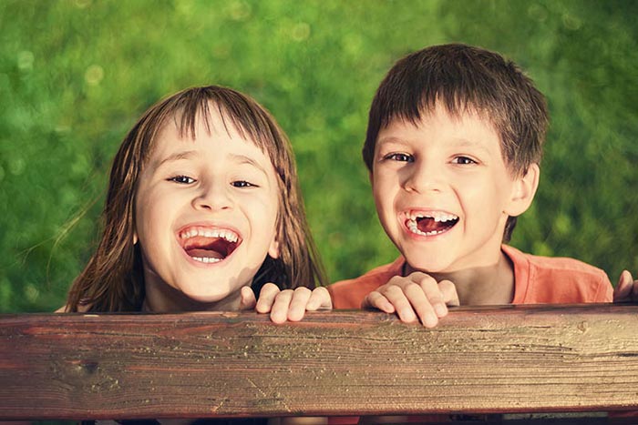 Children showing their teeth