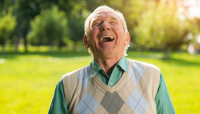 Elderly man laughing