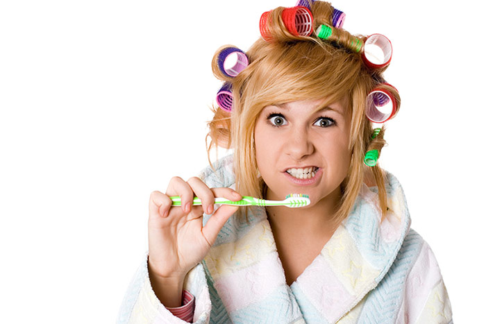 Woman brushing her teeth