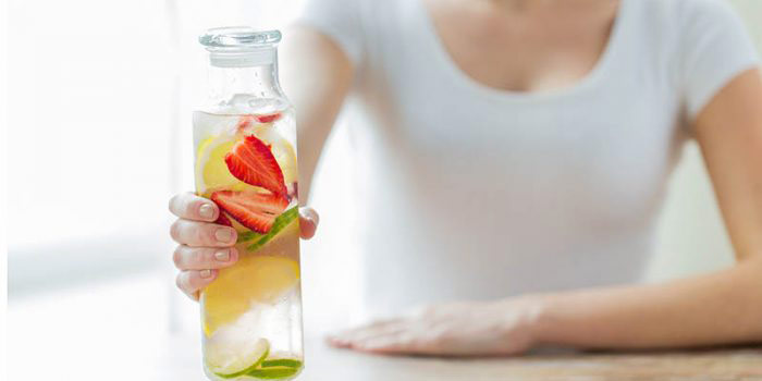 Woman holding detox water